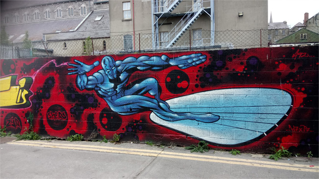 This is a photograph of a painting of the Silver Surfer